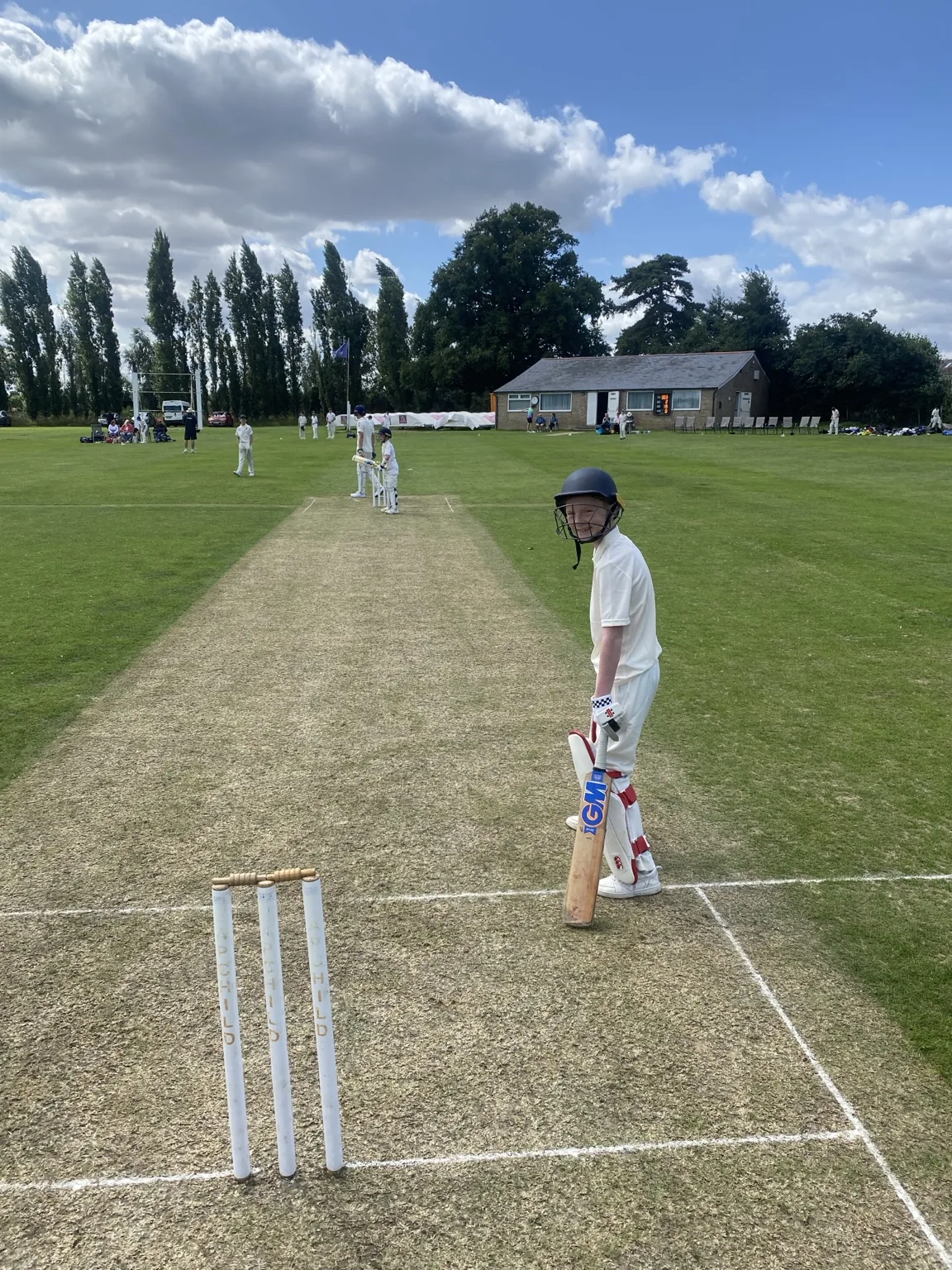 Junior batter ready to face on a cricket wicket