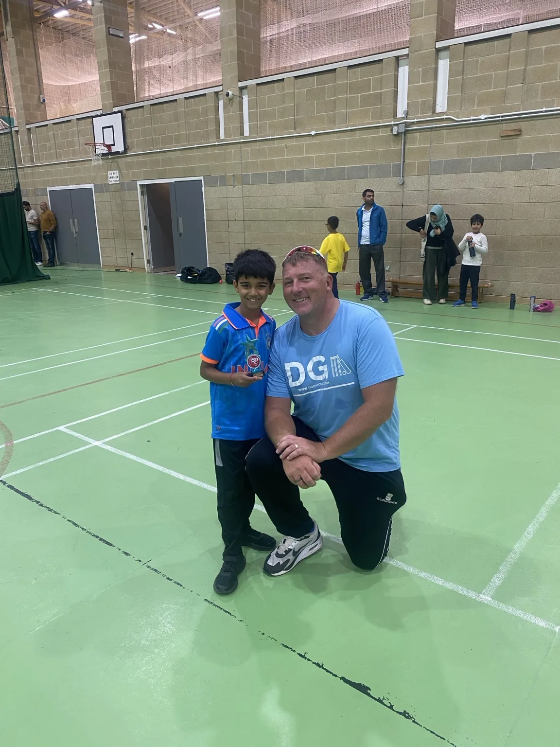 David Goodchild presenting an award to a young player